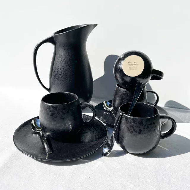 cappuccino mugs black coffee saucers water jug black